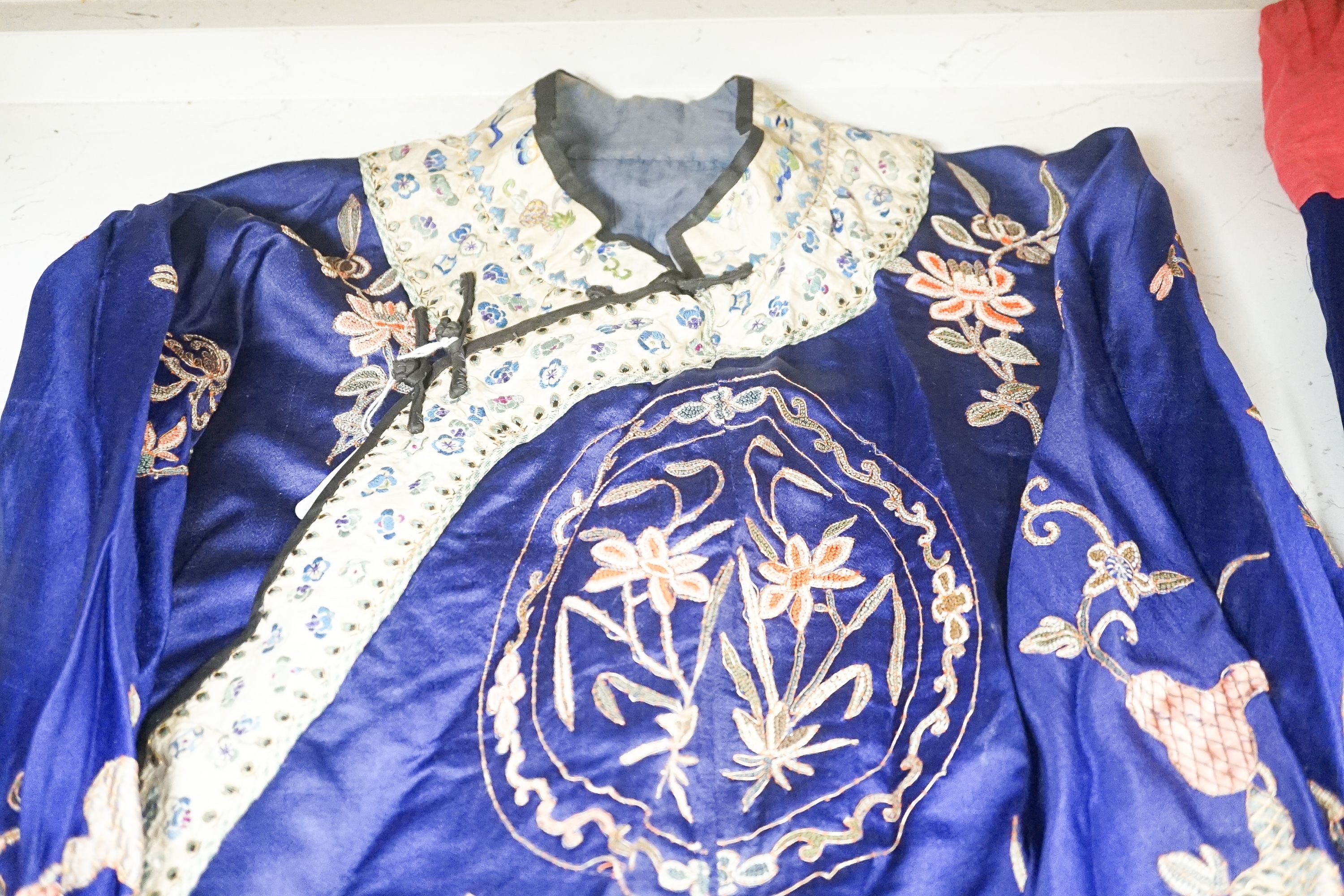 A Chinese embroidered silk robe and a matching pair of trousers